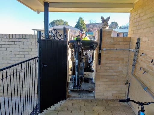 Access through tight fitting areas to reach a job in the back yard.